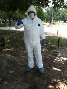 Beyond Borders member in a full Tyvek suit with a mask, gloves, and booties on