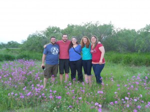 Group photo in a field with purple flowers