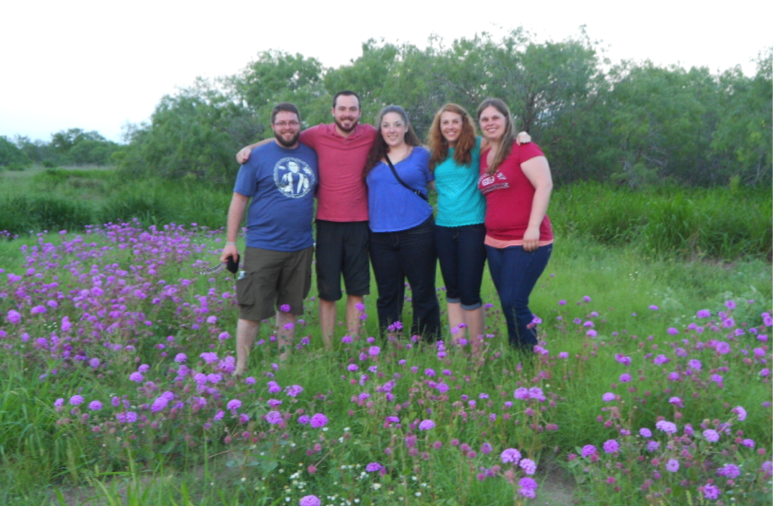 The team from UIndy standing in a field of Heart’s Delight at the Lasater Ranch