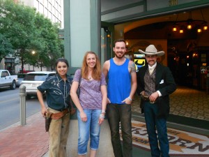 Dr. Latham and Ryan with two people in Texas garb