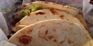 Brisket tacos in a basket with paper lining