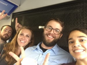 Group photo of Beyond Borders team members holding up one and two fingers for day 12