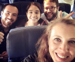 Group photo of Beyond Borders team members on the plane back home