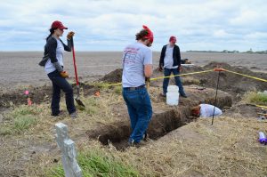 UIndy's team digging trenches to investigate the area