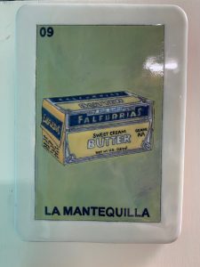 Lotería painting showing Falfurrias Butter at La Mota