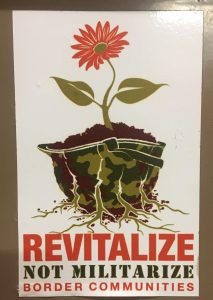 "Revitalize not militarize border communities" poster
