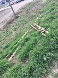 Broken ladder on the ground near the wall