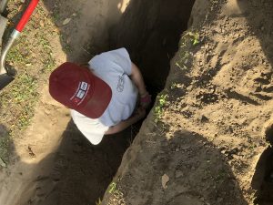 Team member in a trench