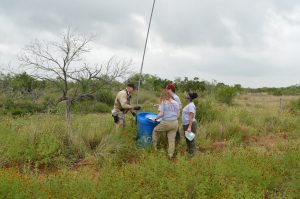Team members filling a water station