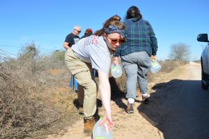 Team members filling a water station