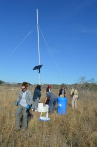 Team members with a water station