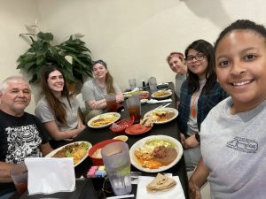 Beyond Borders Team members and Eddie at dinner