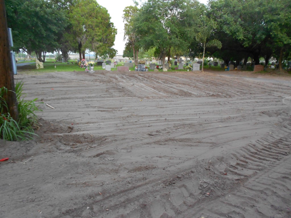 The same area of the cemetery leveled with dirt