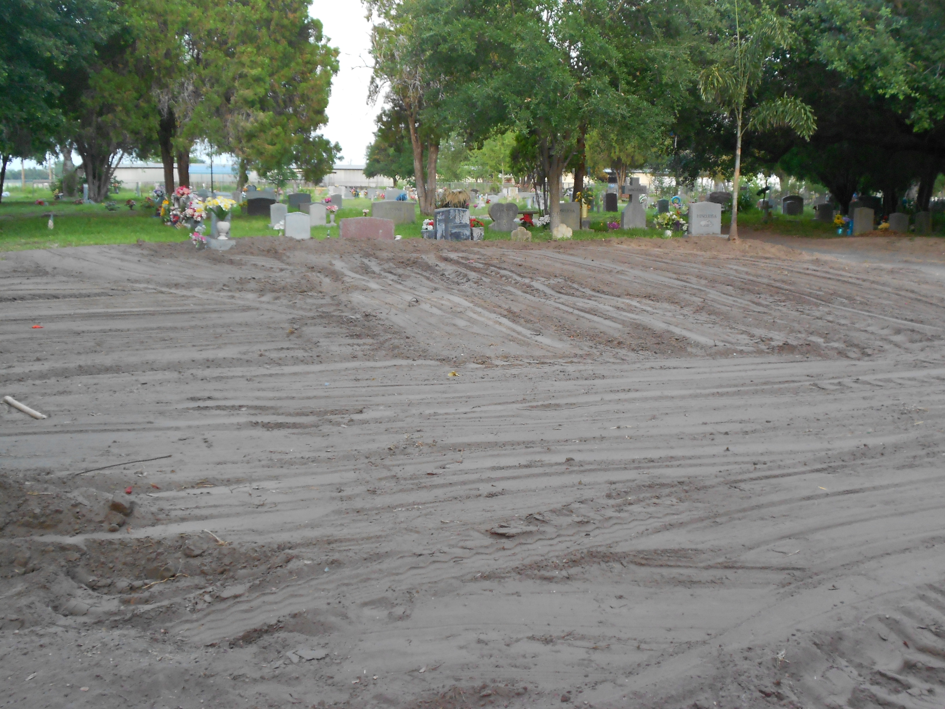 Cemetery area leveled with dirt