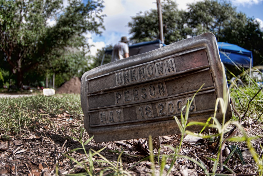 Metal burial Marker reading "Unknown Person May 16 2008"