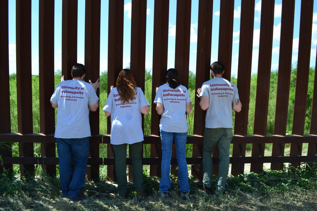 Four Beyond Borders Team members at the wall at the TX/Mexico border