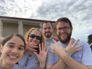 Group image of Beyond Borders Team members holding up eight fingers for day 8