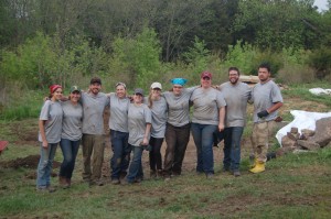 The University of Indianapolis Archeology & Forensics Lab team group photo on the site of a forensic recovery in rural Iowa. 