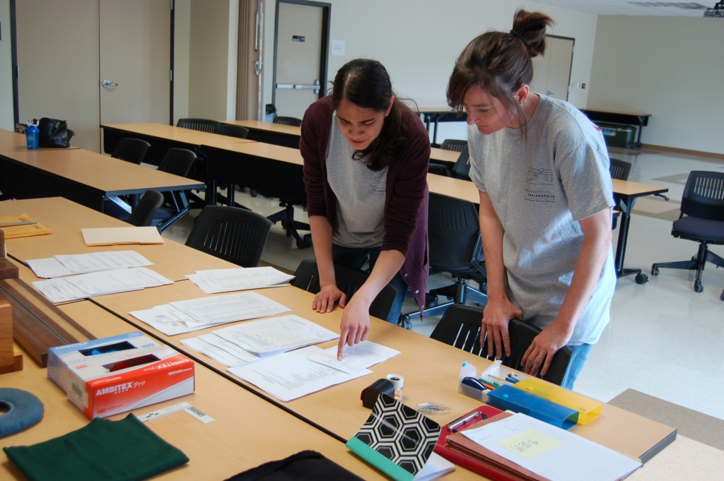 Beyond Borders Team Members looking through paperwork laid out on a clean table