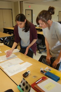 Two team members going over paperwork in a lab