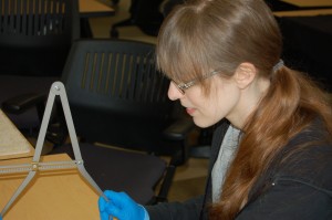 Beyond Borders Team Member performing measurements using a spreading caliper