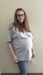 Dr. Latham 32 weeks pregnant in her UIndy Human Identification Center Lab shirt