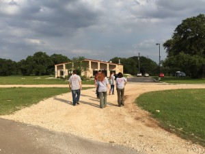 Team members walking towards a building 