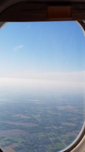 Looking out an airplane window.