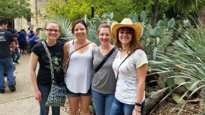 Group photo in front of cacti.