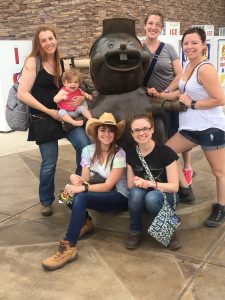 Group photo with metal statue.