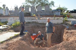 Texas State team members excavating a burial.