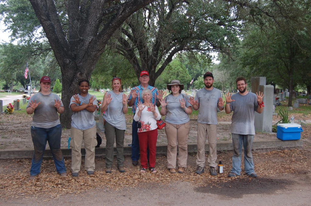 Group photo with Erica's Grandparents present, all holding up 9 fingers 