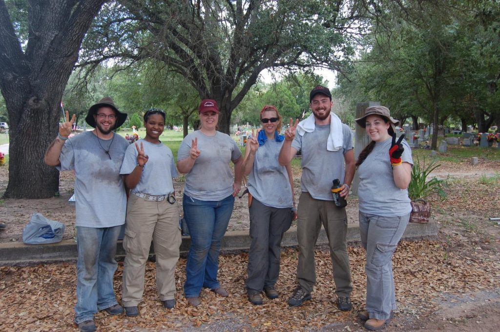 Day 2 Uindy Group photo with two fingers in the air