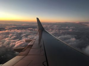 Sunset over wing of plane.