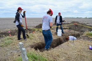 Team members digging trenches.