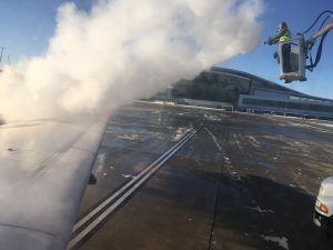 Workers defrosting the plane.