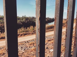 Looking through the border wall.