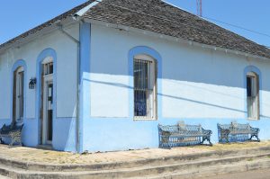 One of the colorful buildings with intricate benches