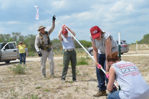 The team setting up a flag to indicate a water station