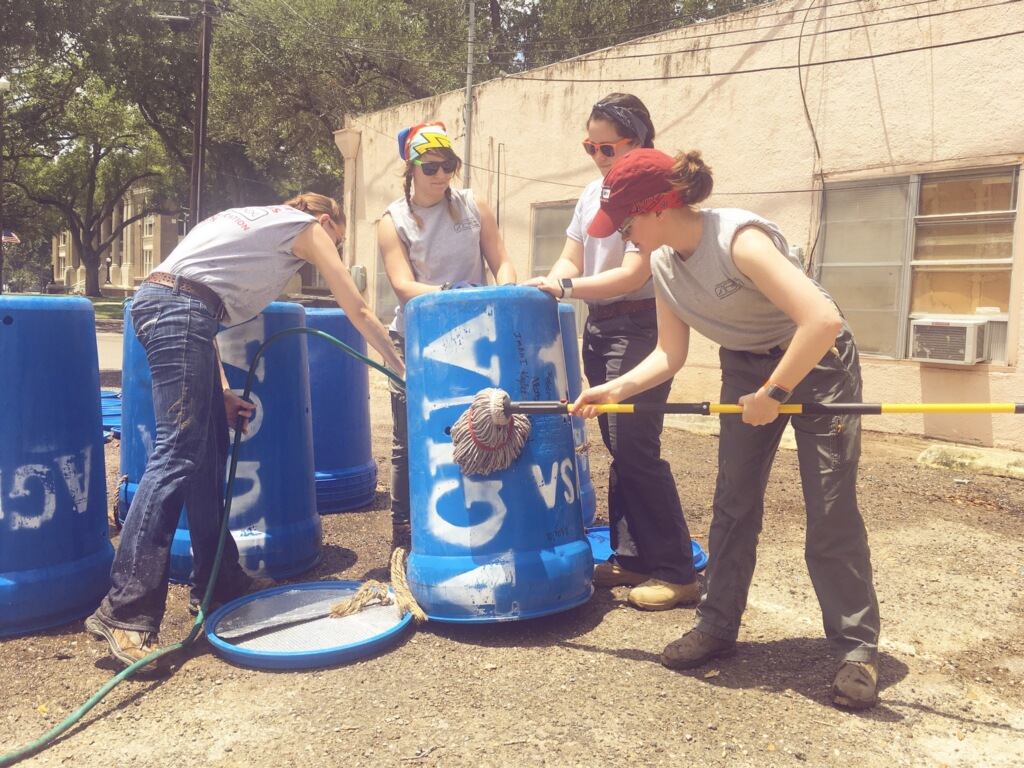 Team members cleaning water stations