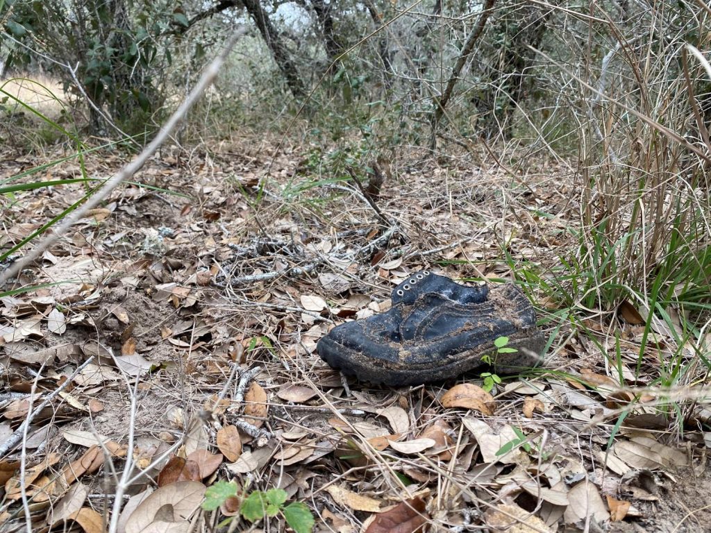 Migrants shoe left behind in the brush
