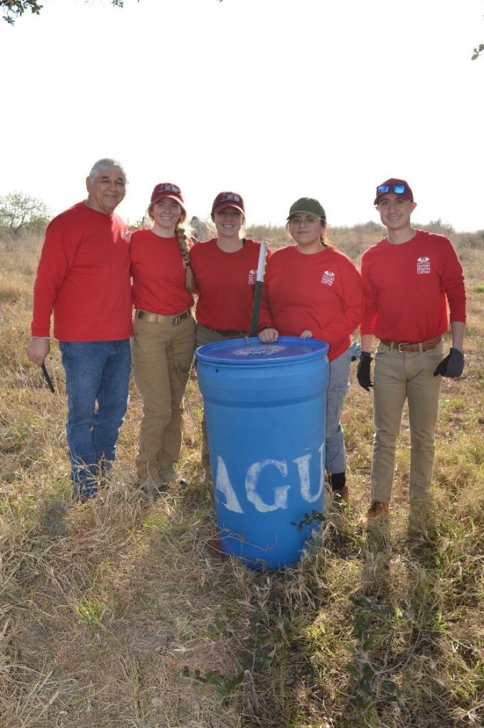 Beyond Borders Team with Eddie and a water station