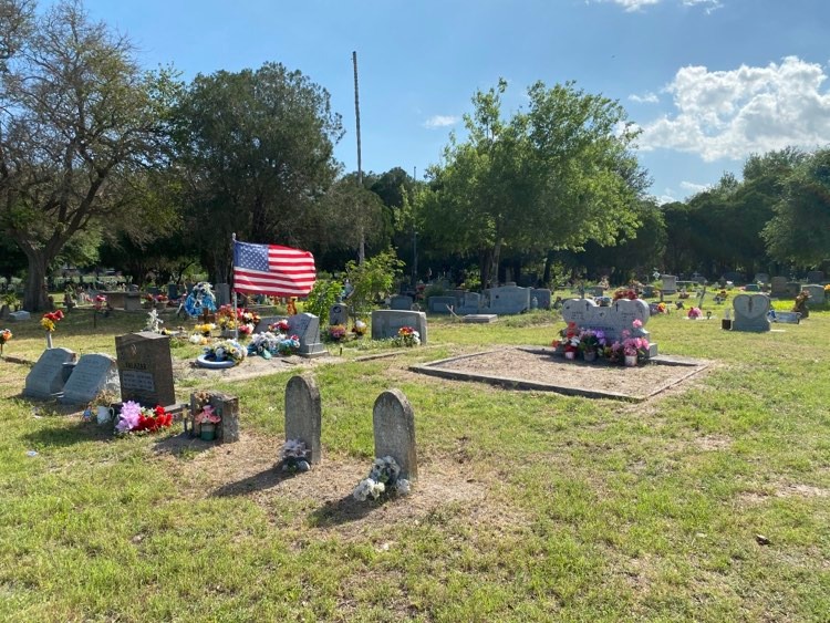 Decorated headstones at Sacred Heart Cemetery