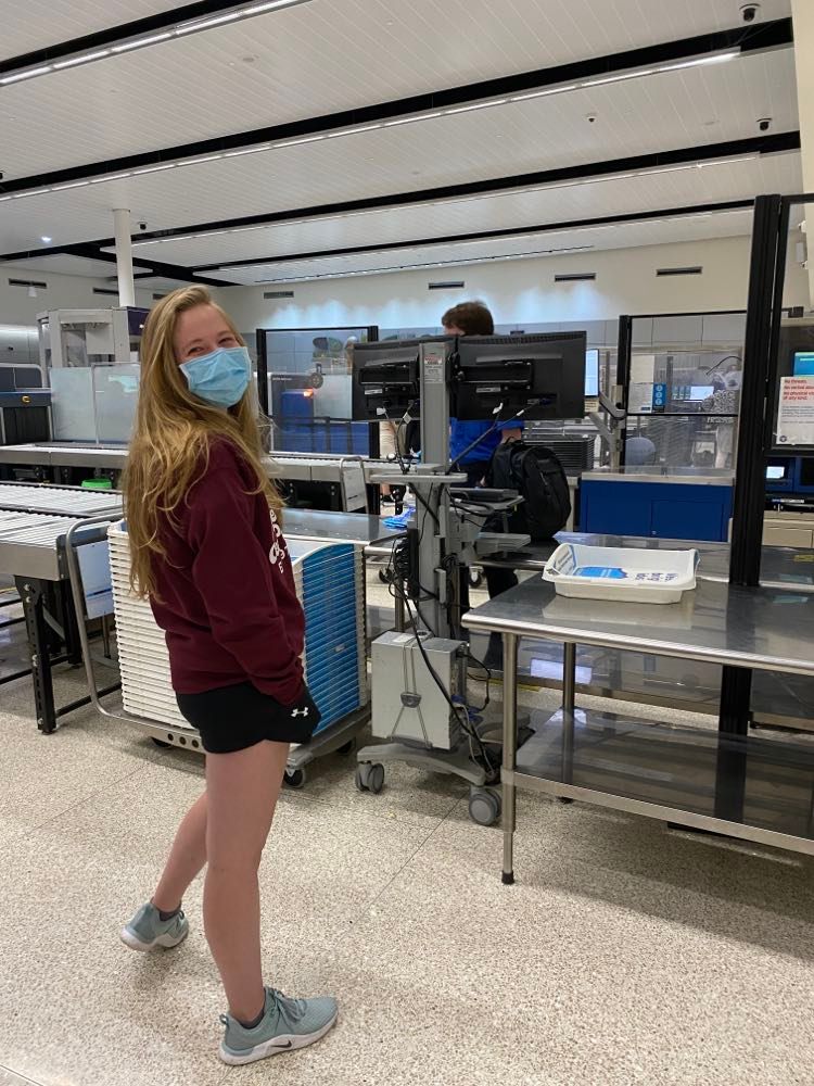 Team members bag getting searched at airport security