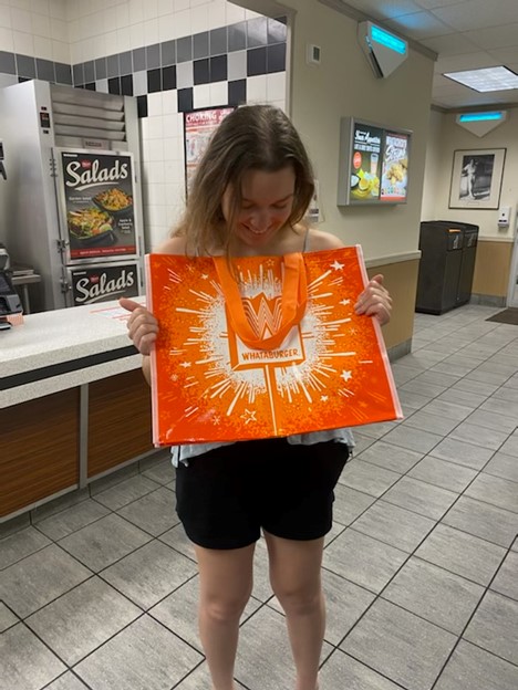 Izzy and her new Whataburger bag