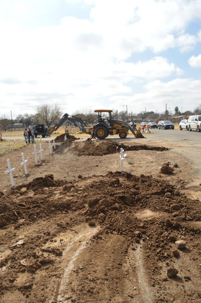 The backhoe working at the cemetery 