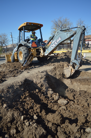 The backhoe working at the cemetery 