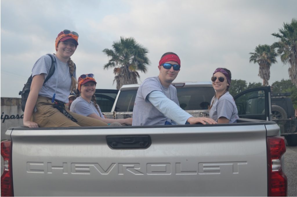 The team in the back of a truck