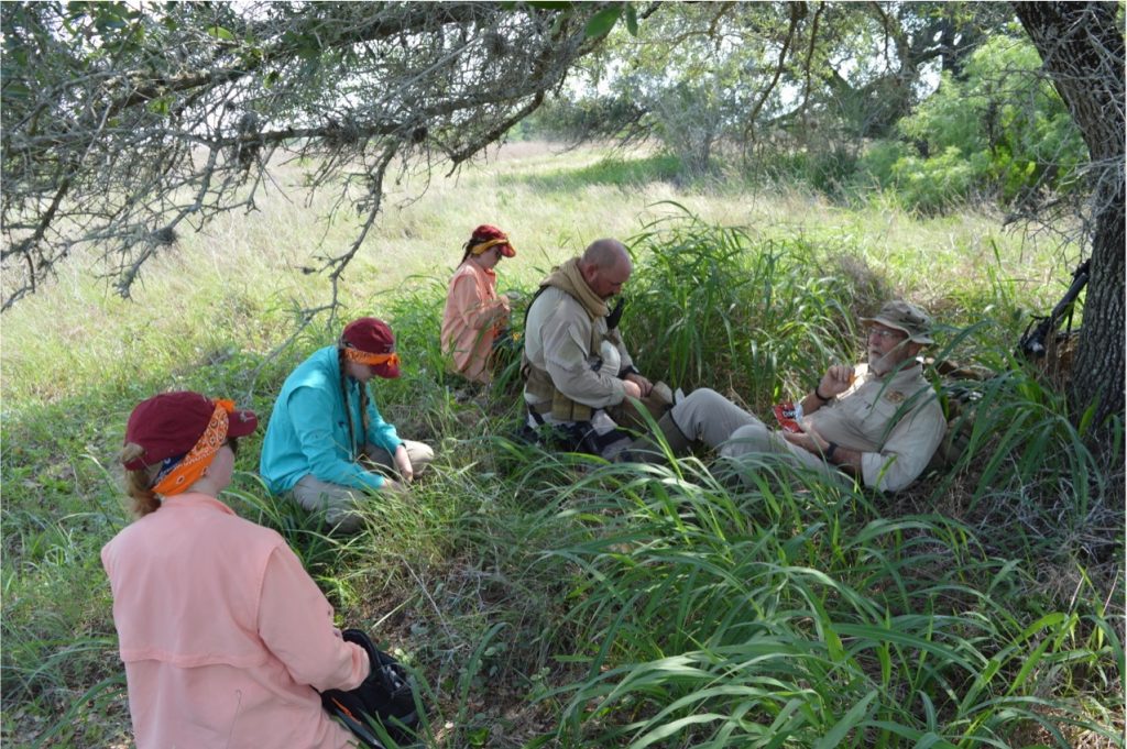 The team taking a break in the brush