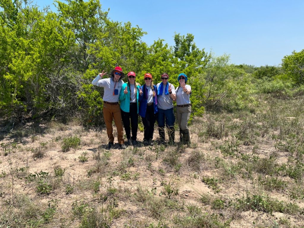 Beyond borders group photo in the brush